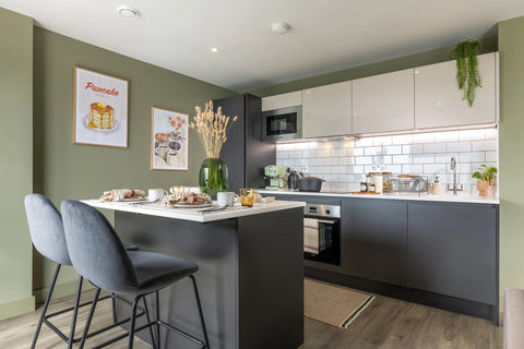 apartment kitchen with bar stools and kitchen accessories