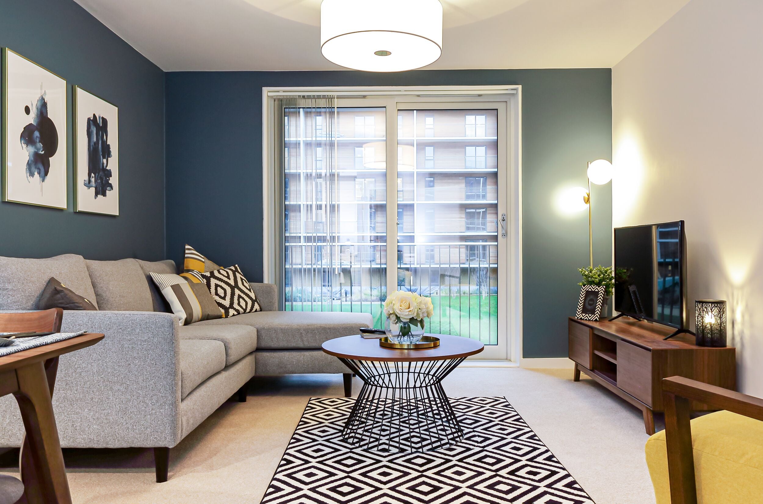 Chapel Wharf Manchester, Living room with corner sofa, coffee table, media unit and rug furnished by LOFT