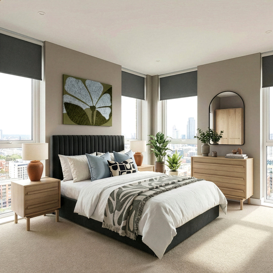 Modern bedroom with a bed, bedside table, chest of drawers, and decor elements.