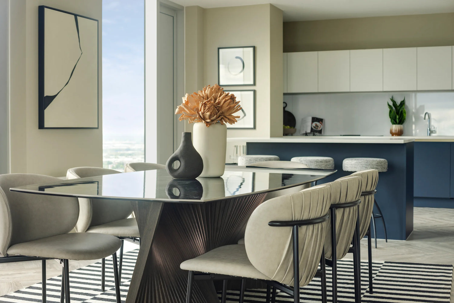 apartment dining area and kitchen, with black coffee table, chairs and bar stools