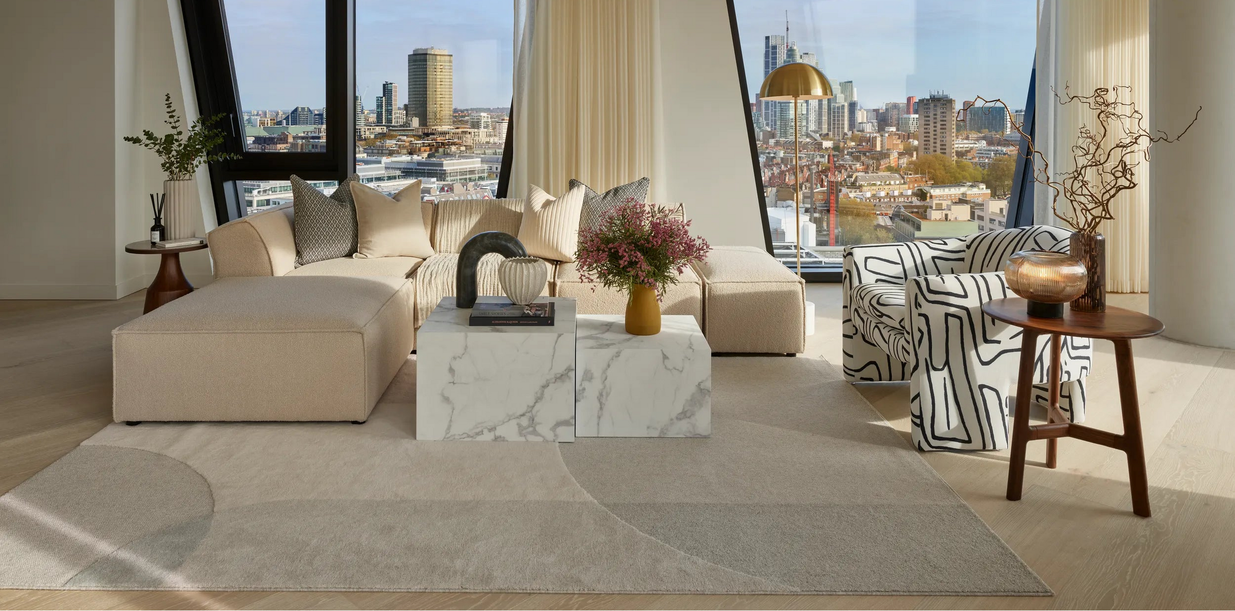 Modern living room with large windows overlooking a cityscape