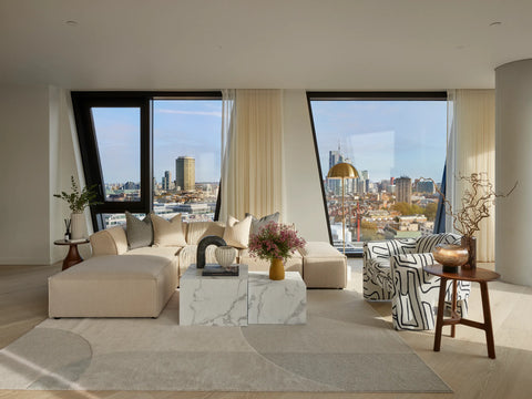 apartment living room with corner sofa, chair, coffee table and accessories