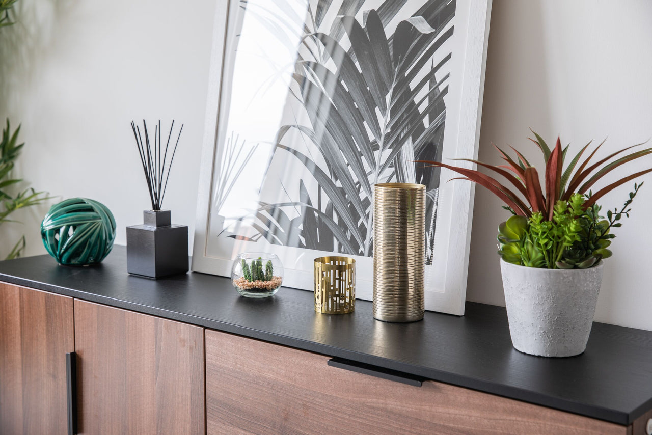  Sideboard and accessories featuring faux plants