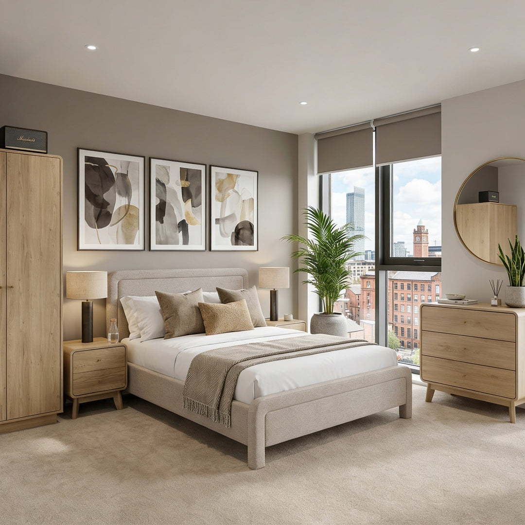 Modern apartment bedroom with light colours, a bed, bedside tables, wardrobe and chest of drawers