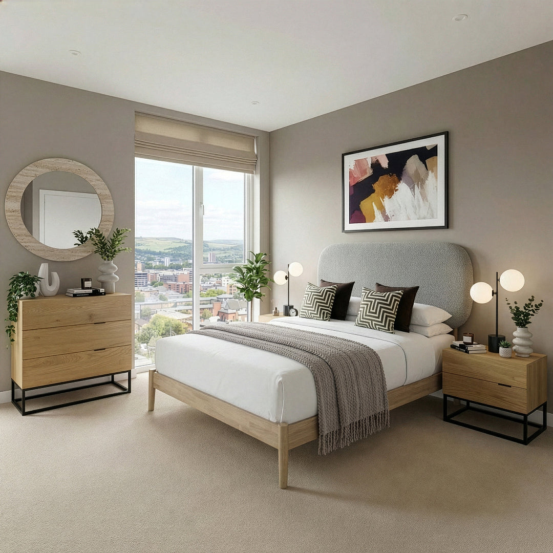 Modern bedroom with a bed, bedside table, chest of drawers, and decor elements.