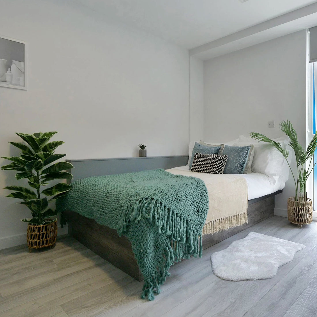  Urban Hub Student Accommodation bedroom with faux plants and throw