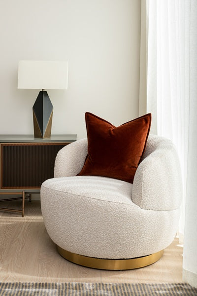 white occasional chair with red cushion