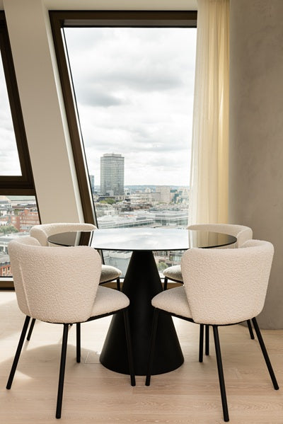 black dining table, white chairs with black legs
