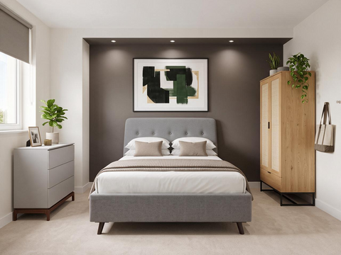 bedroom lifestyle image with bed, wardrobe and chest with black accent wall