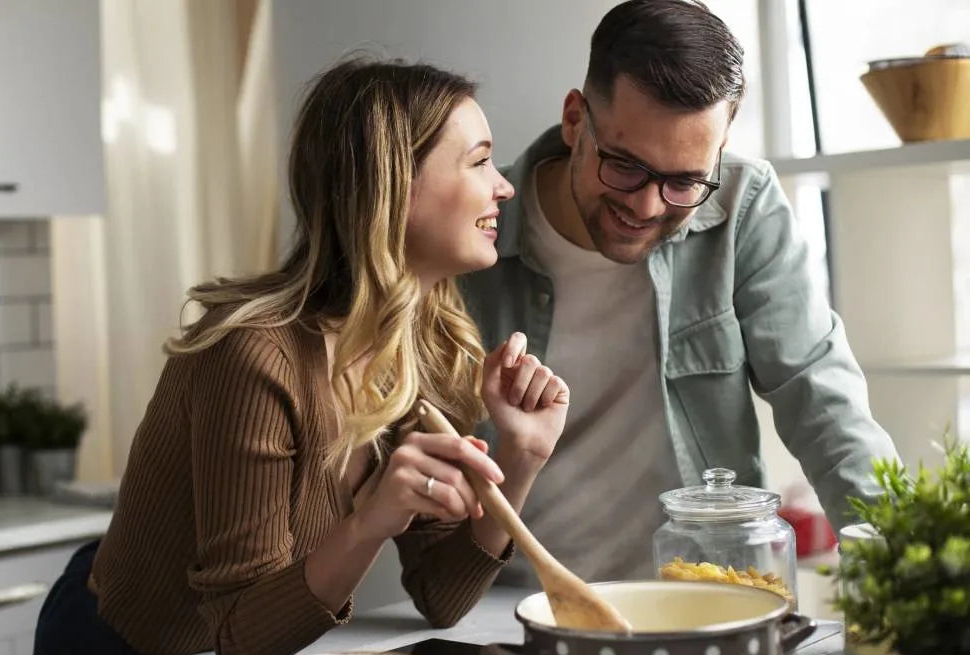 Man and woman cooking together in a kitchen