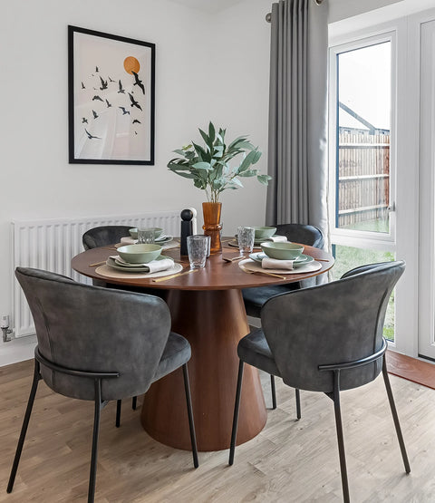 dining area with dark wooden table, grey chairs and accessories